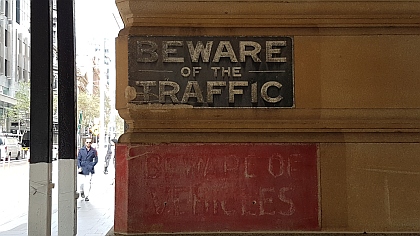 Ghost sign at Sydney GPO warning of horses and carts